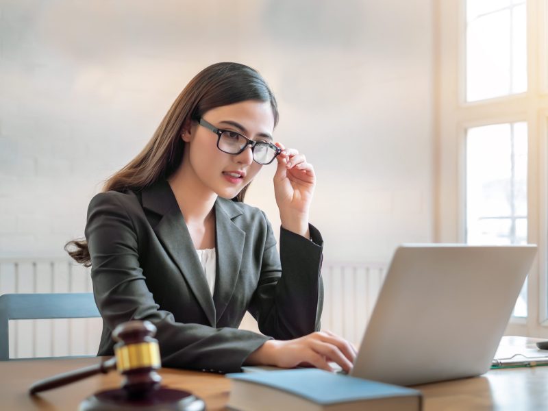 beautiful young asian lawyer woman sitting working in the office.